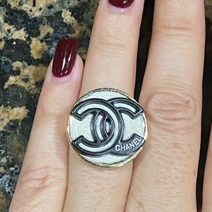 Black and iridescent white button adjustable ring. Base is 24k gold plated.